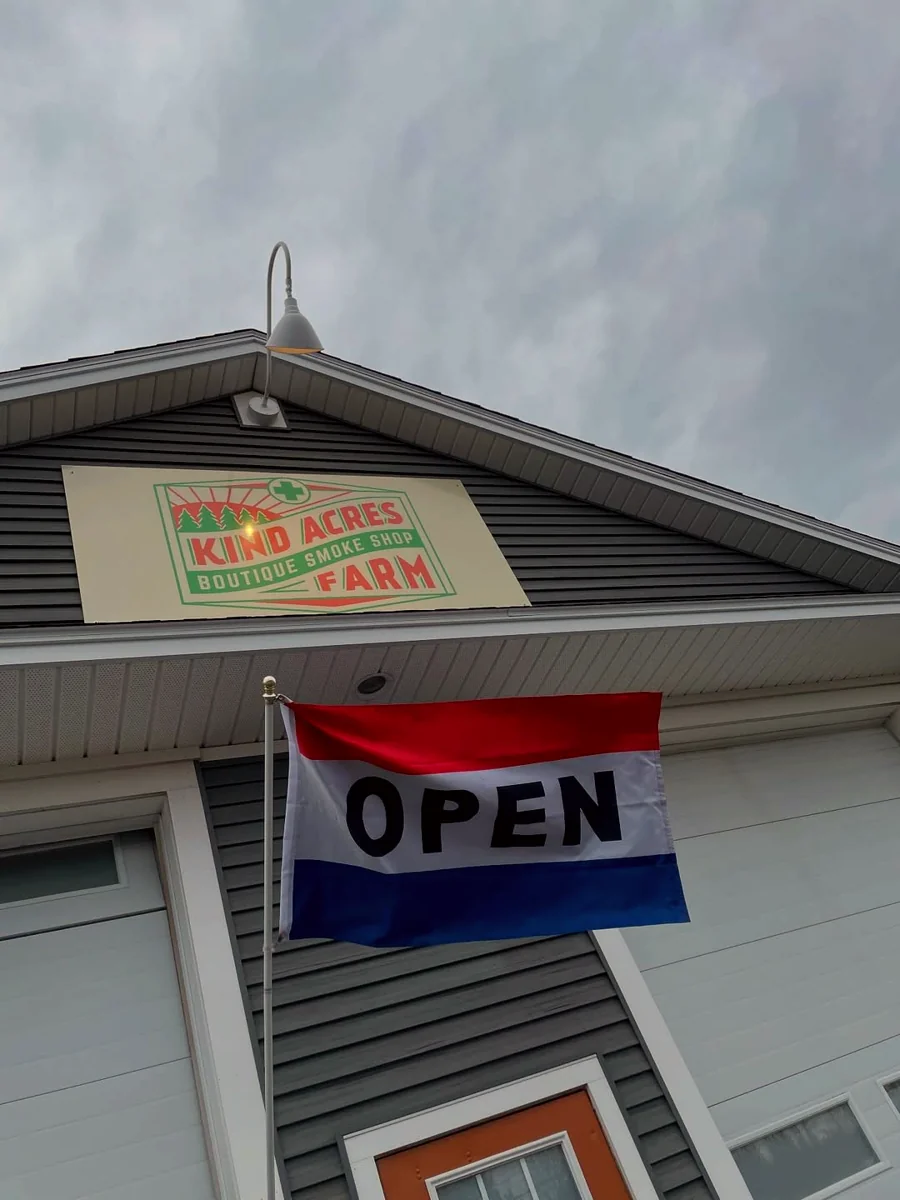 KIND ACRES FARM sign and OPEN flag
